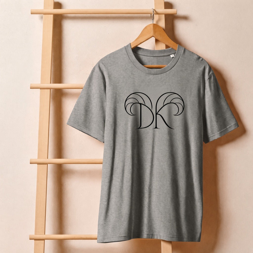 Keep Dreaming Aries Zodiac Tee front — approved DK brand logo with Aries horns on heather grey