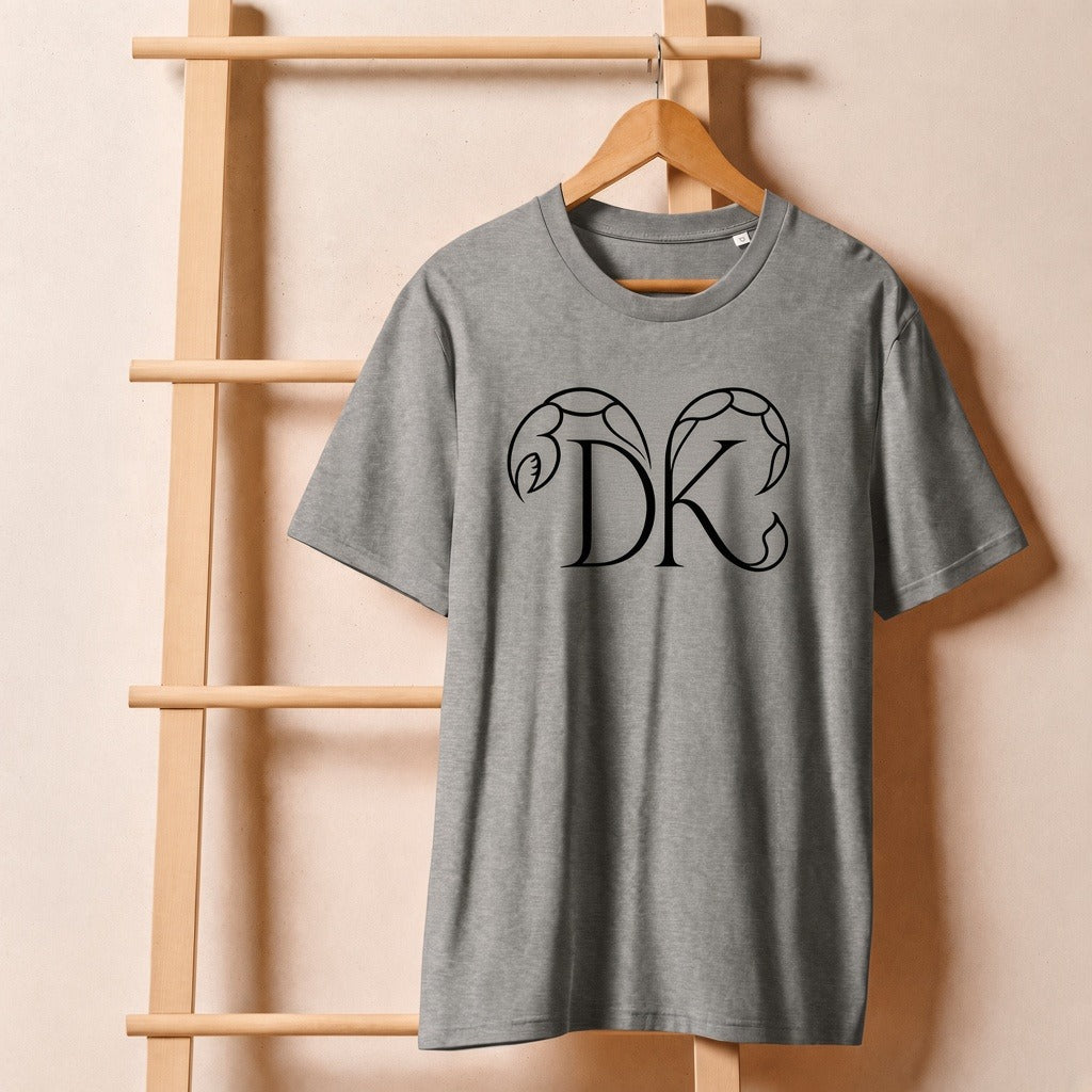 Keep Dreaming Scorpio Zodiac Tee front — DK monogram with scorpion pincer and stinger on heather grey